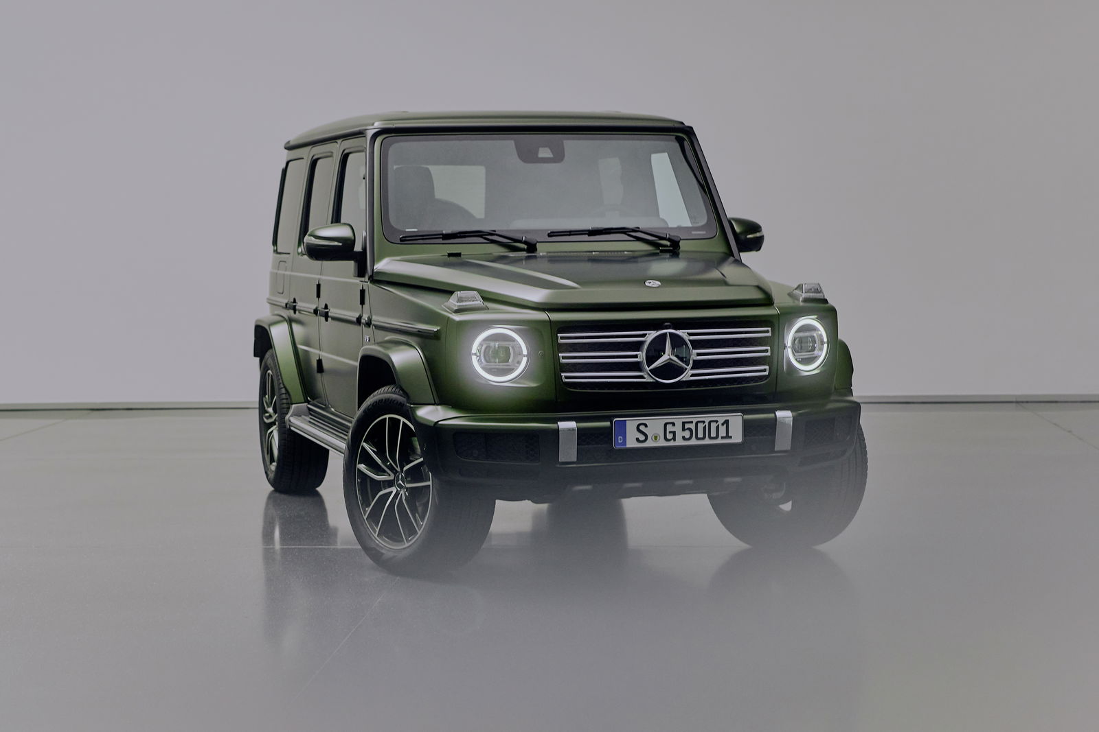 A green Mercedes-Benz G500 G-Class