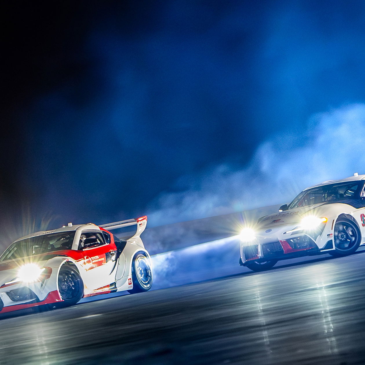Two autonomous Toyota GR Supras drifting
