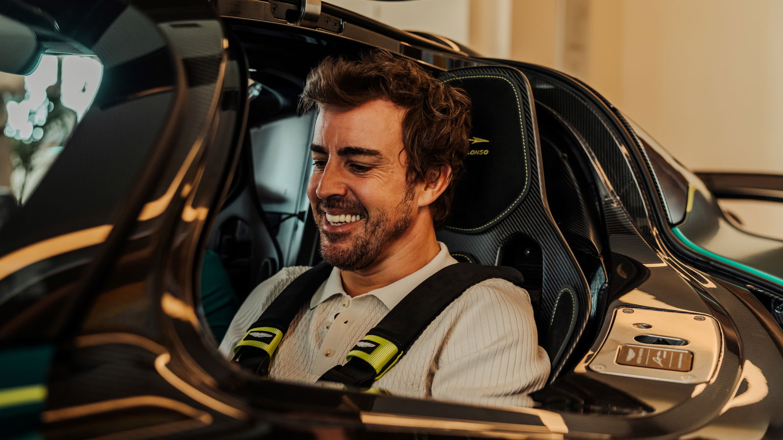 Fernando Alonso sits in his Aston Martin Valkyrie