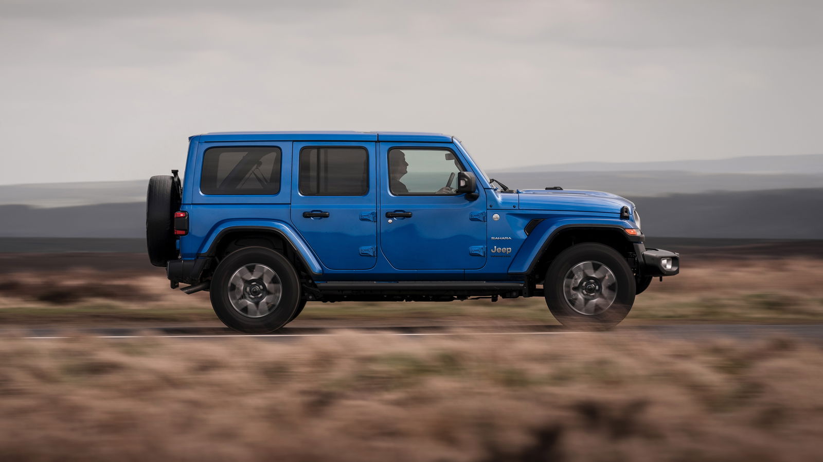 Jeep Wrangler - side, driving