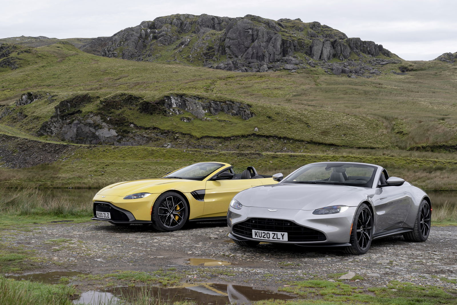 The Vantage Roadster on the right has the new optional vaned grille